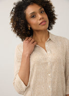 Close-up of striped beige and white shirt showing button details by French Dressing Jeans (FDJ)
