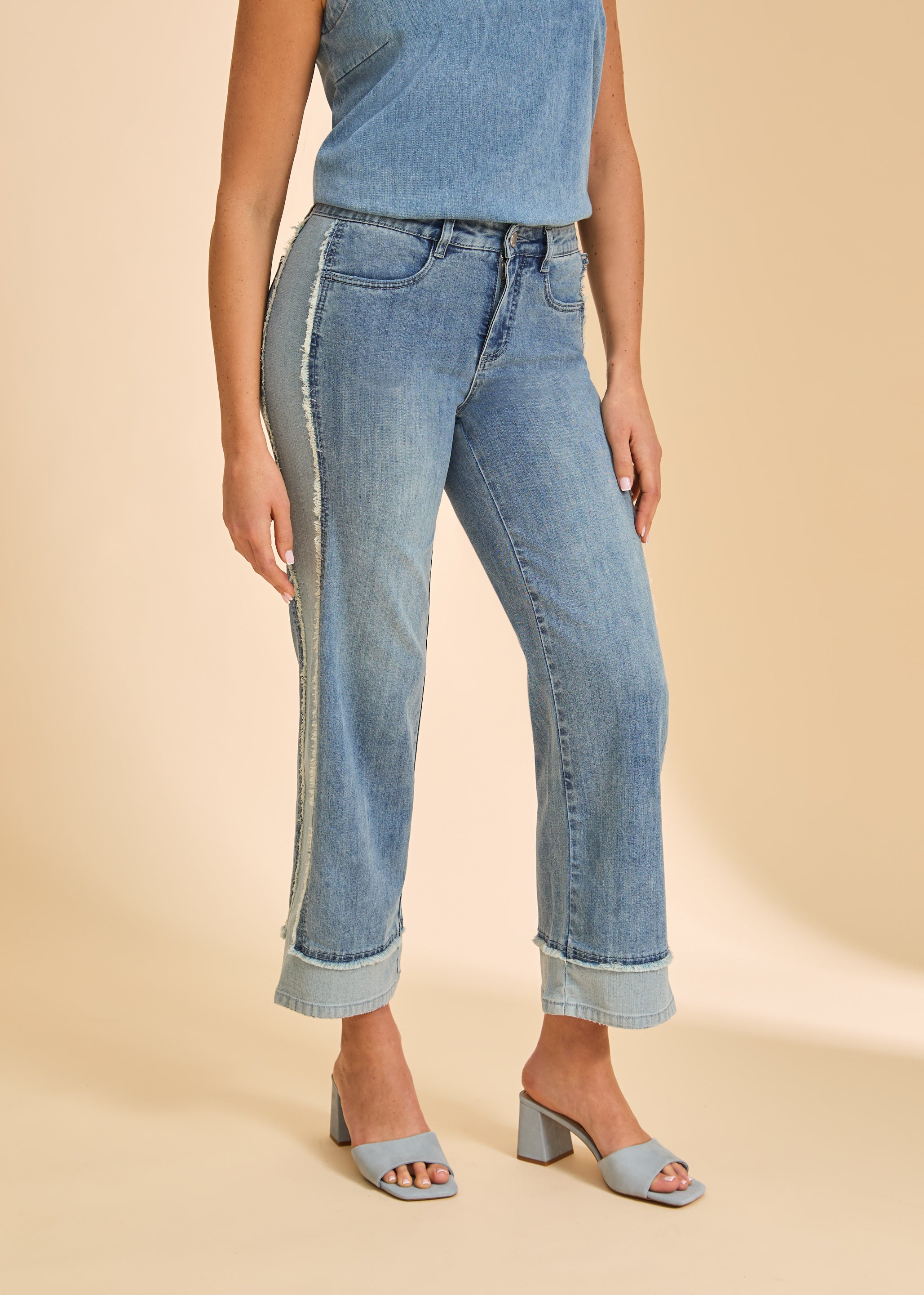 Close-up of light wash Olivia wide ankle denim highlighting front welt pockets and frayed side seams by French Dressing Jeans (FDJ)