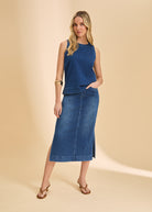 Full view of blue denim top paired with matching skirt, completing the look by French Dressing Jeans (FDJ)