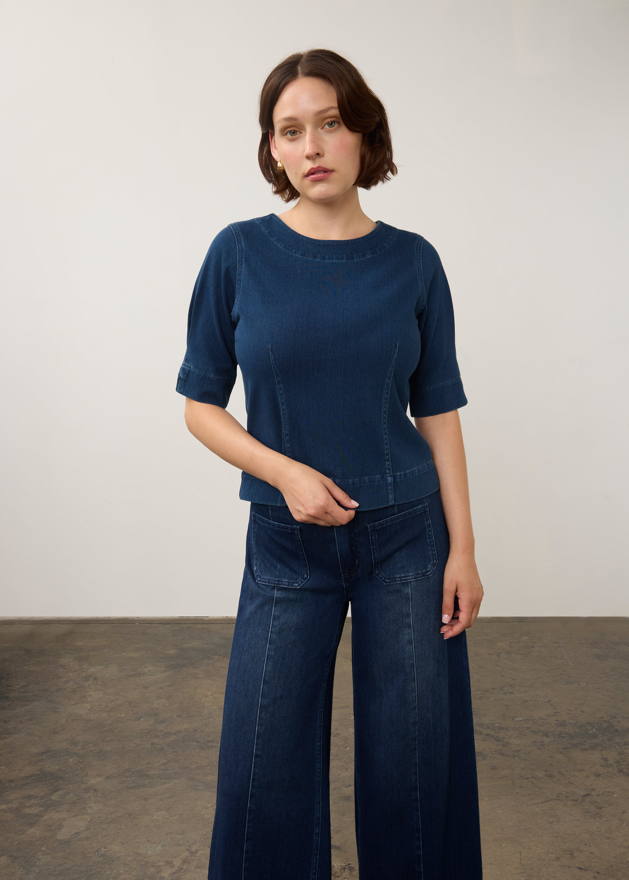 Dark rinse fitted top with elbow-length sleeves styled with denim jeans by French Dressing Jeans (FDJ)