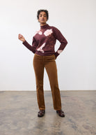 Full body view of burgundy floral sweater paired with brown corduroy pants by French Dressing Jeans (FDJ)