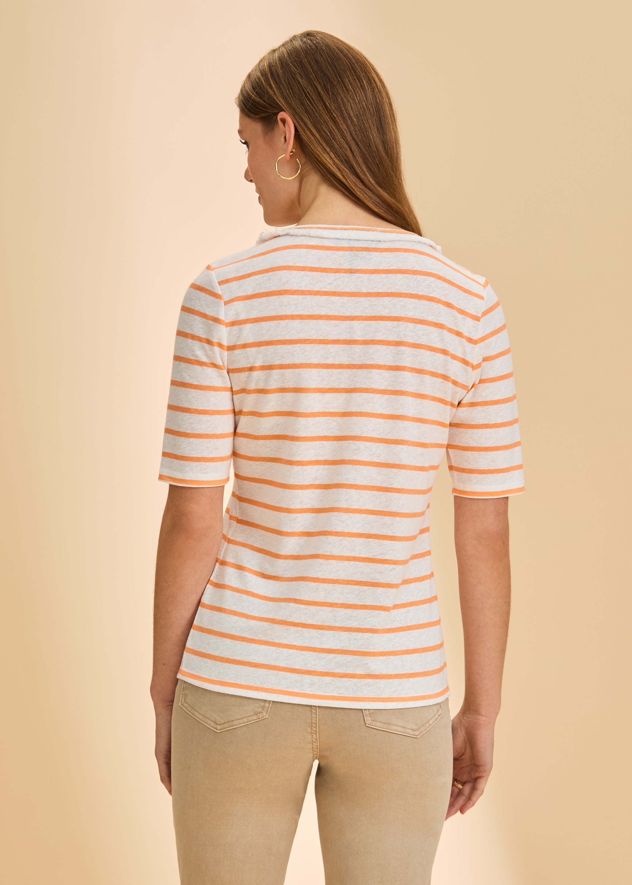 Back view of orange striped V-neck top showing bold stripe pattern by French Dressing Jeans (FDJ)