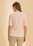 Back view of orange striped V-neck top showing bold stripe pattern by French Dressing Jeans (FDJ)