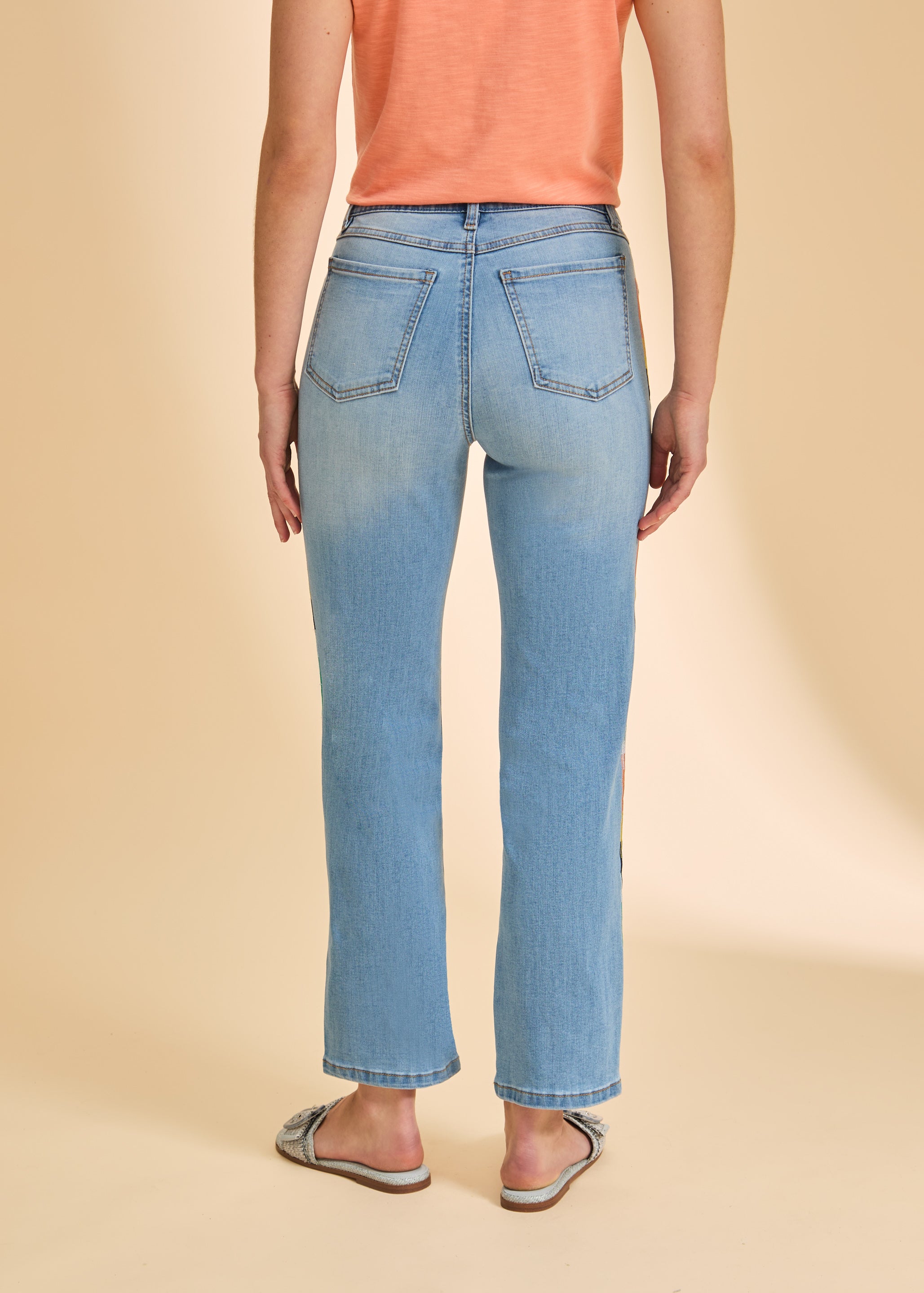 Back view of medium blue straight ankle jeans showing patch pockets and smooth fit by French Dressing Jeans (FDJ)