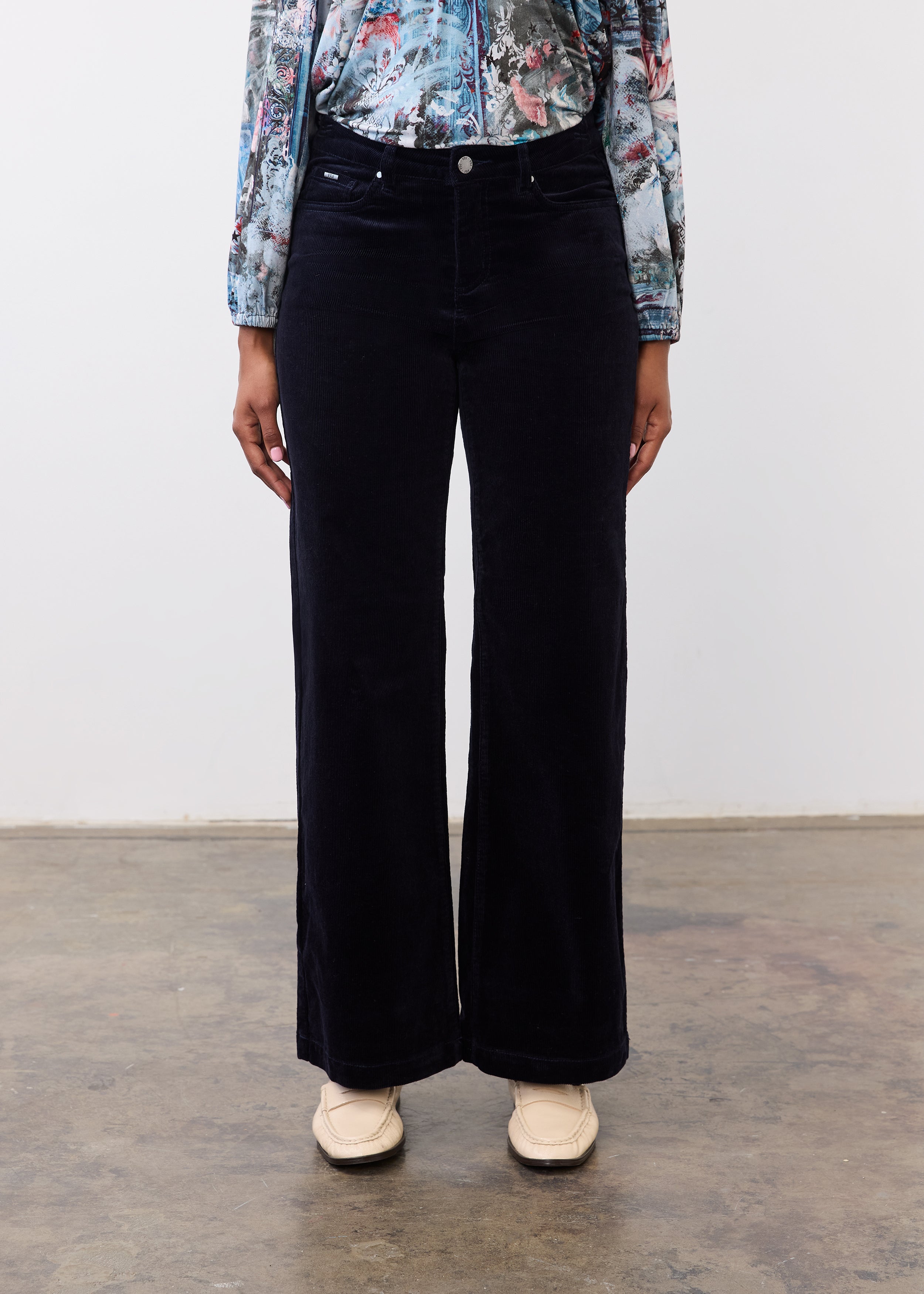 Front view of black Olivia wide leg pants showcasing mid-rise and clean leg line by French Dressing Jeans (FDJ)