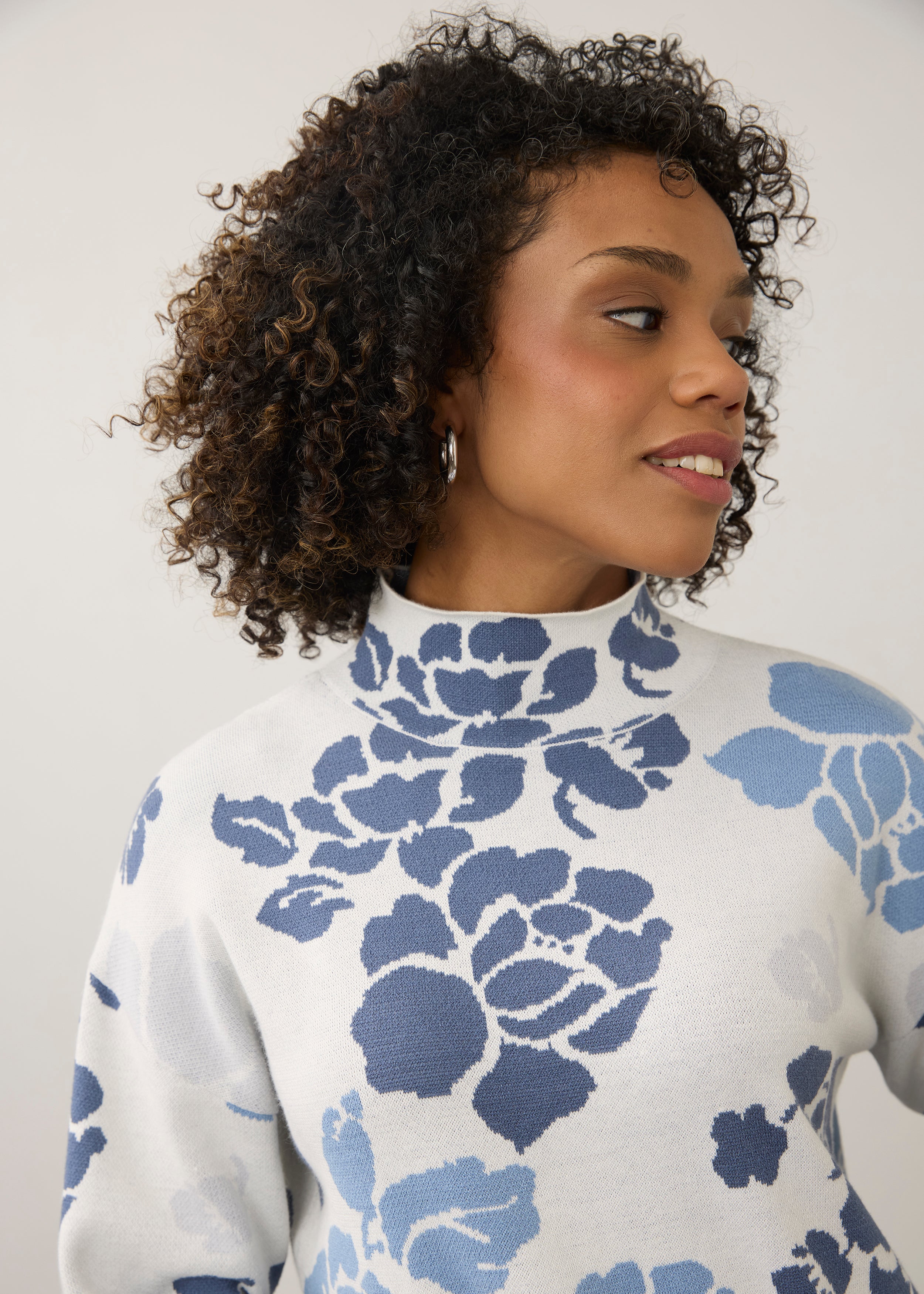 Close-up of blue floral sweater with high collar detail by French Dressing Jeans (FDJ)