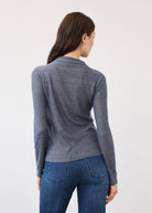 Back view of blue shimmer top showing seamless look and long sleeves by French Dressing Jeans (FDJ)