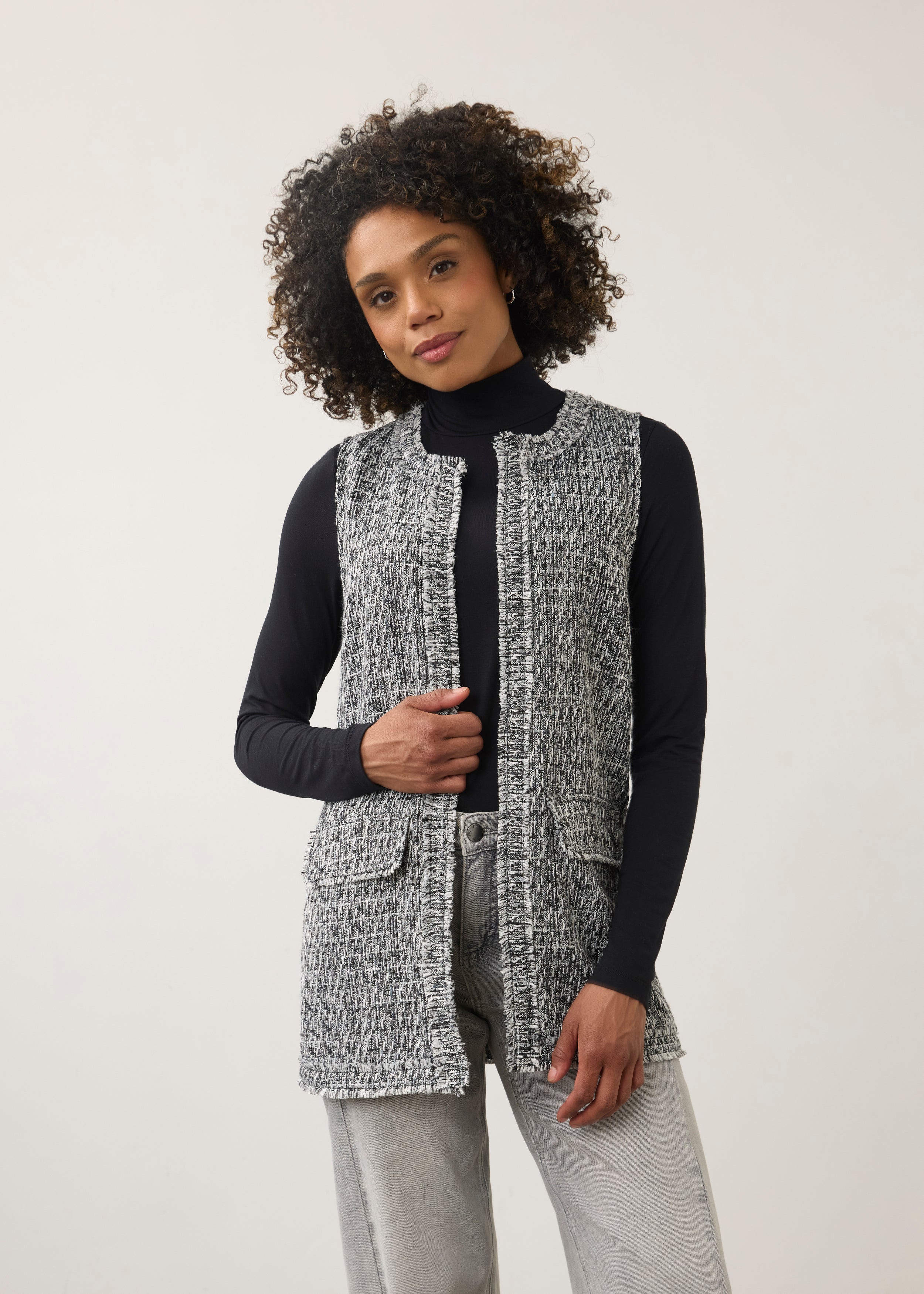 Front view of black and white textured vest with patch pockets and fringe detailing by French Dressing Jeans (FDJ)