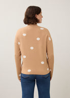Back view of tan polka dot sweater showing seamless design by French Dressing Jeans (FDJ)