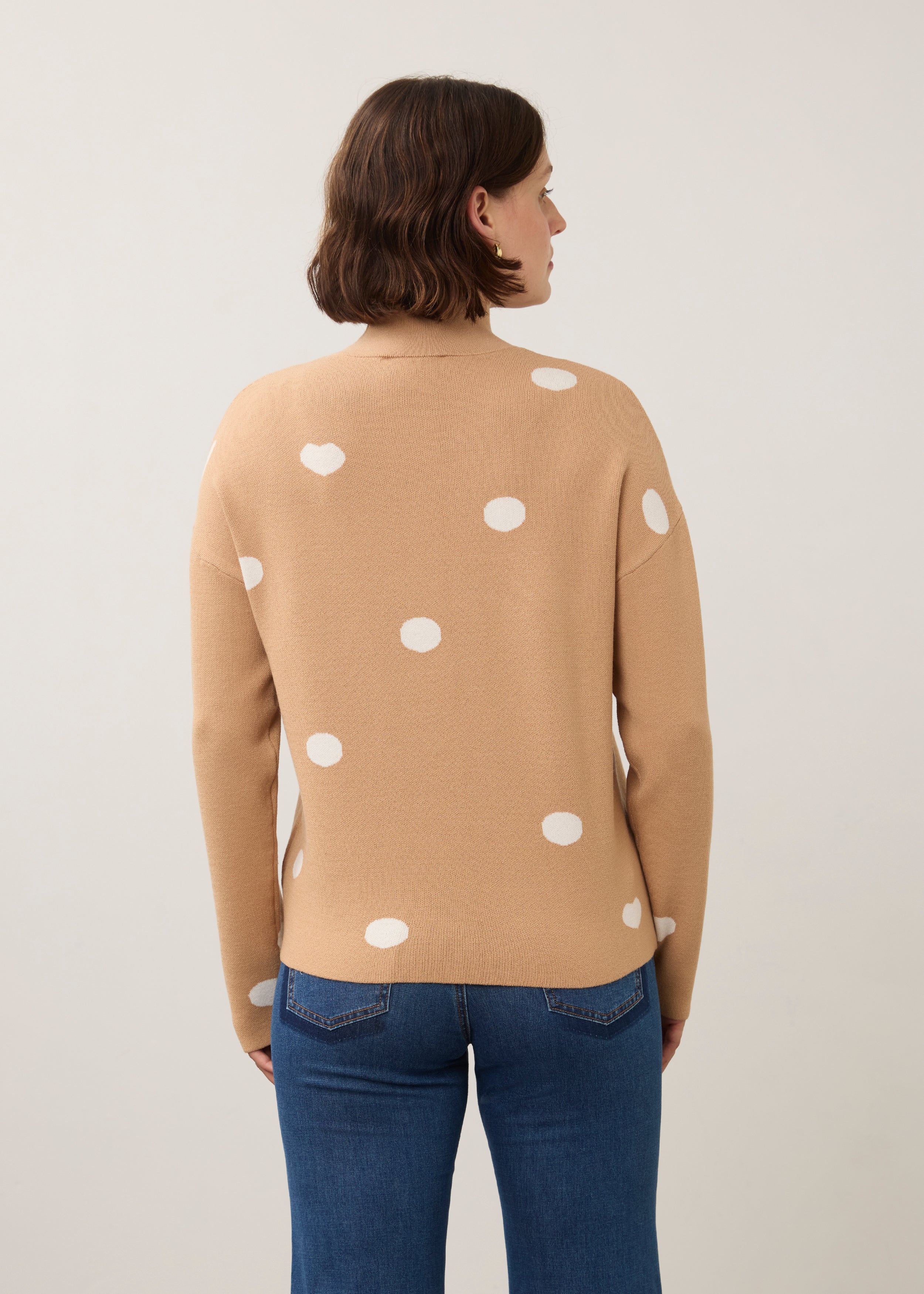 Back view of tan polka dot sweater showing seamless design by French Dressing Jeans (FDJ)