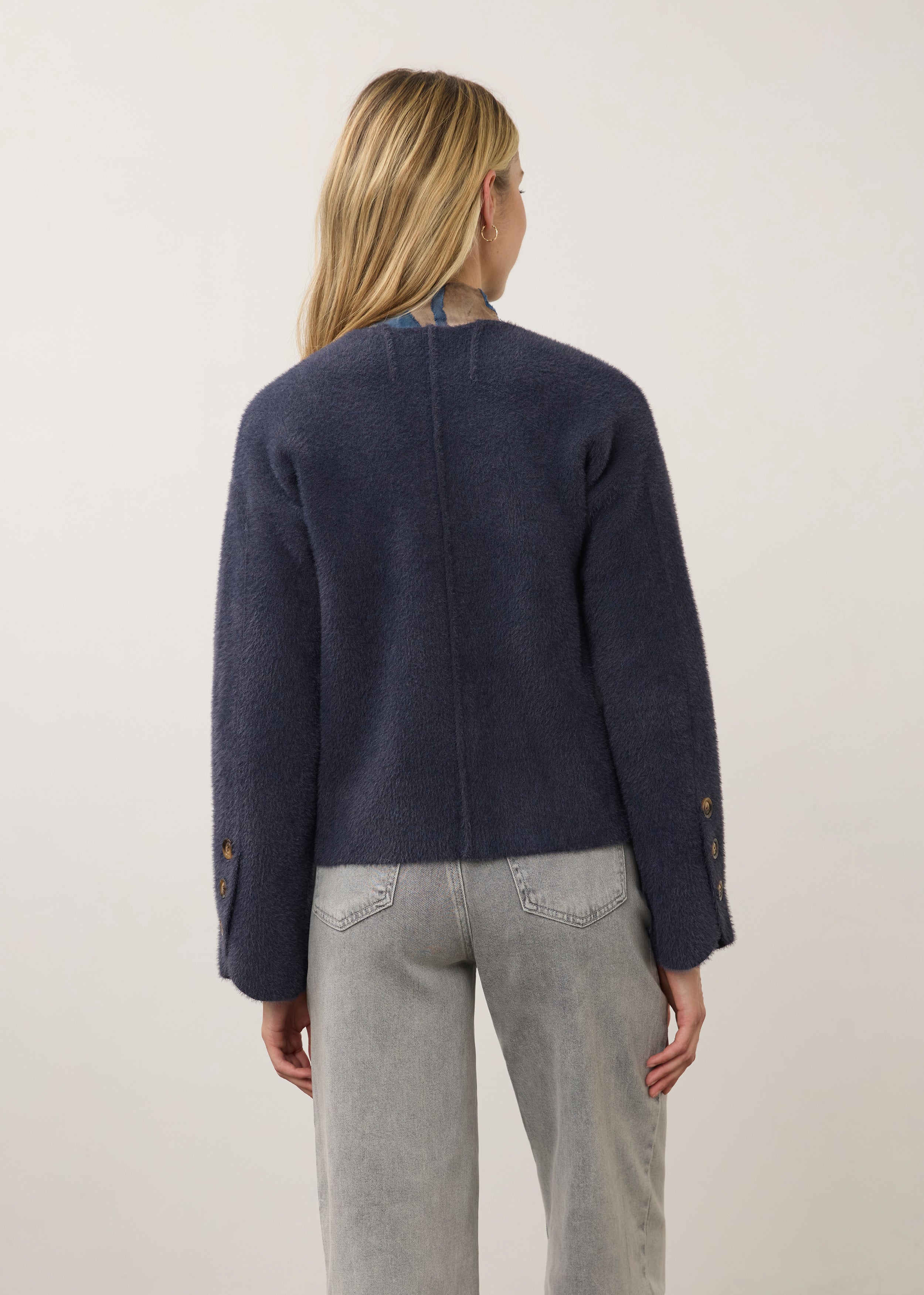Back view of navy knit cardigan highlighting clean seam lines by French Dressing Jeans (FDJ)