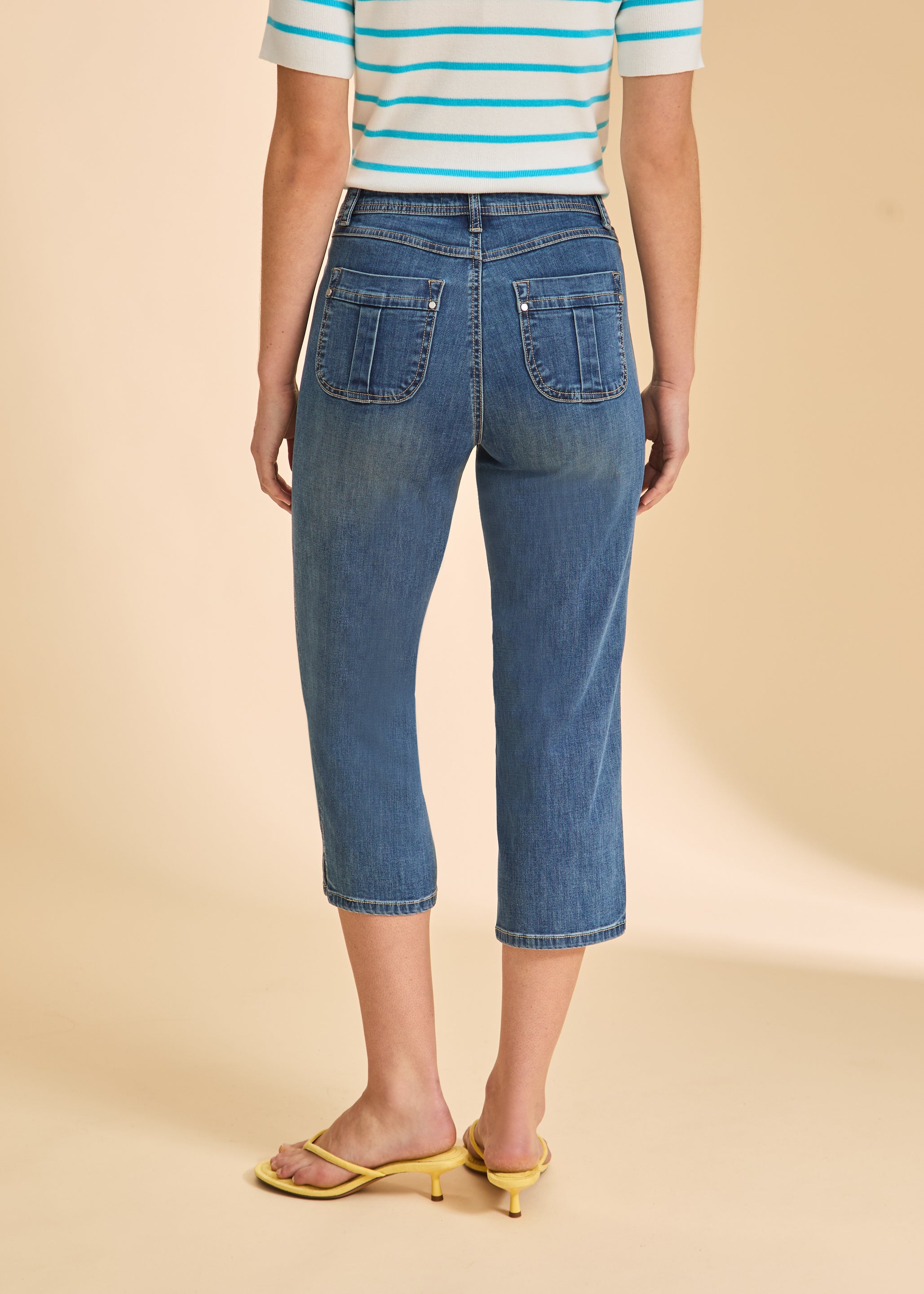 Back view of medium wash cropped jeans with patch pockets by French Dressing Jeans (FDJ)