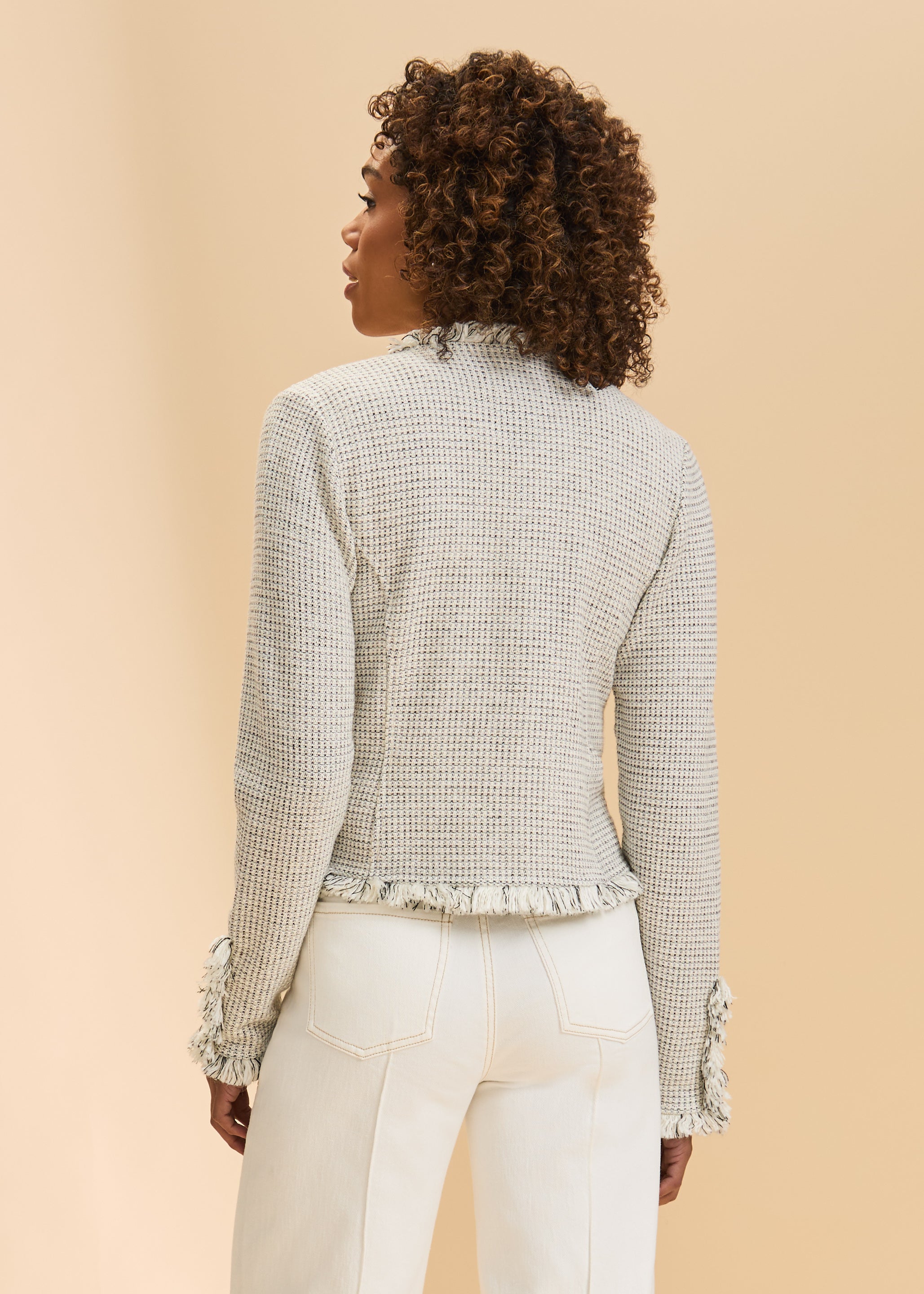 Back view of cream tweed jacket showcasing subtle check pattern and fringe by French Dressing Jeans (FDJ)