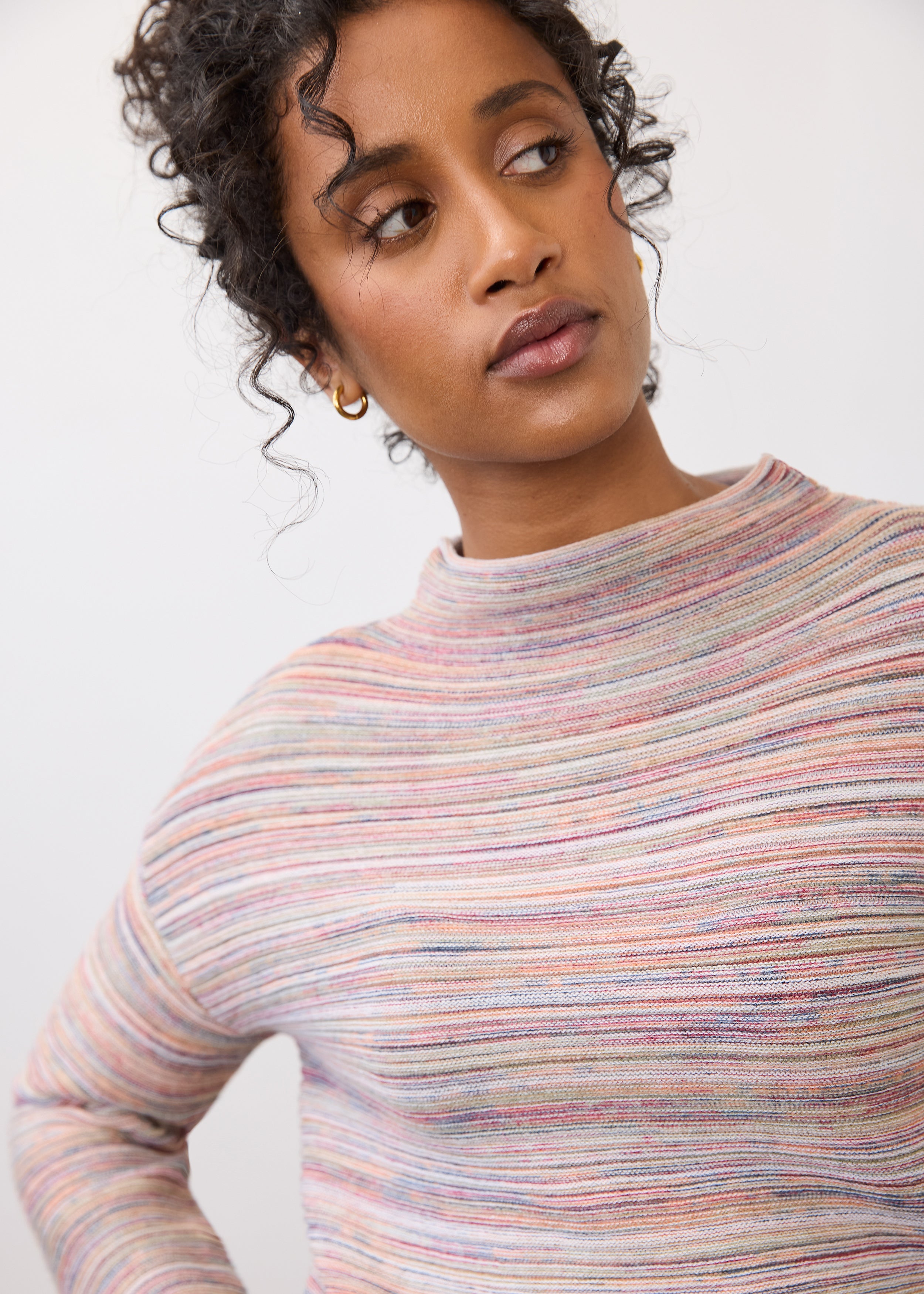 Close-up of argyle sweater highlighting pattern and neckline by French Dressing Jeans (FDJ)