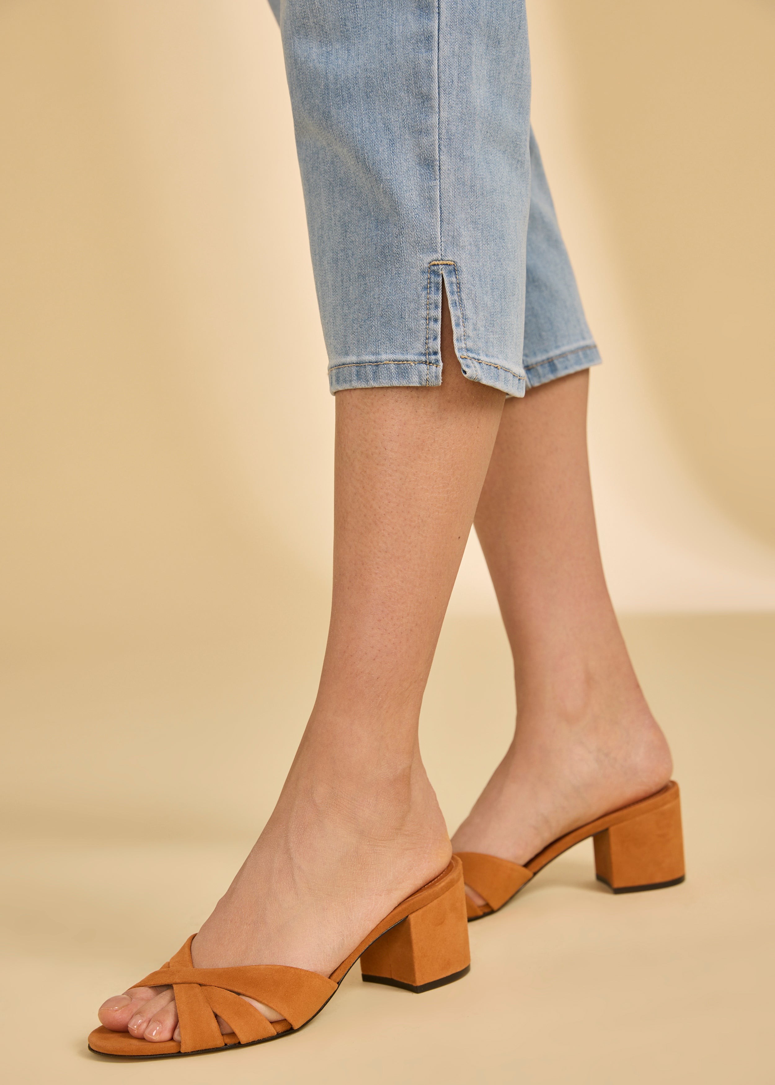 Close-up of cropped jeans in indigo blue showing side slit detail by French Dressing Jeans (FDJ)