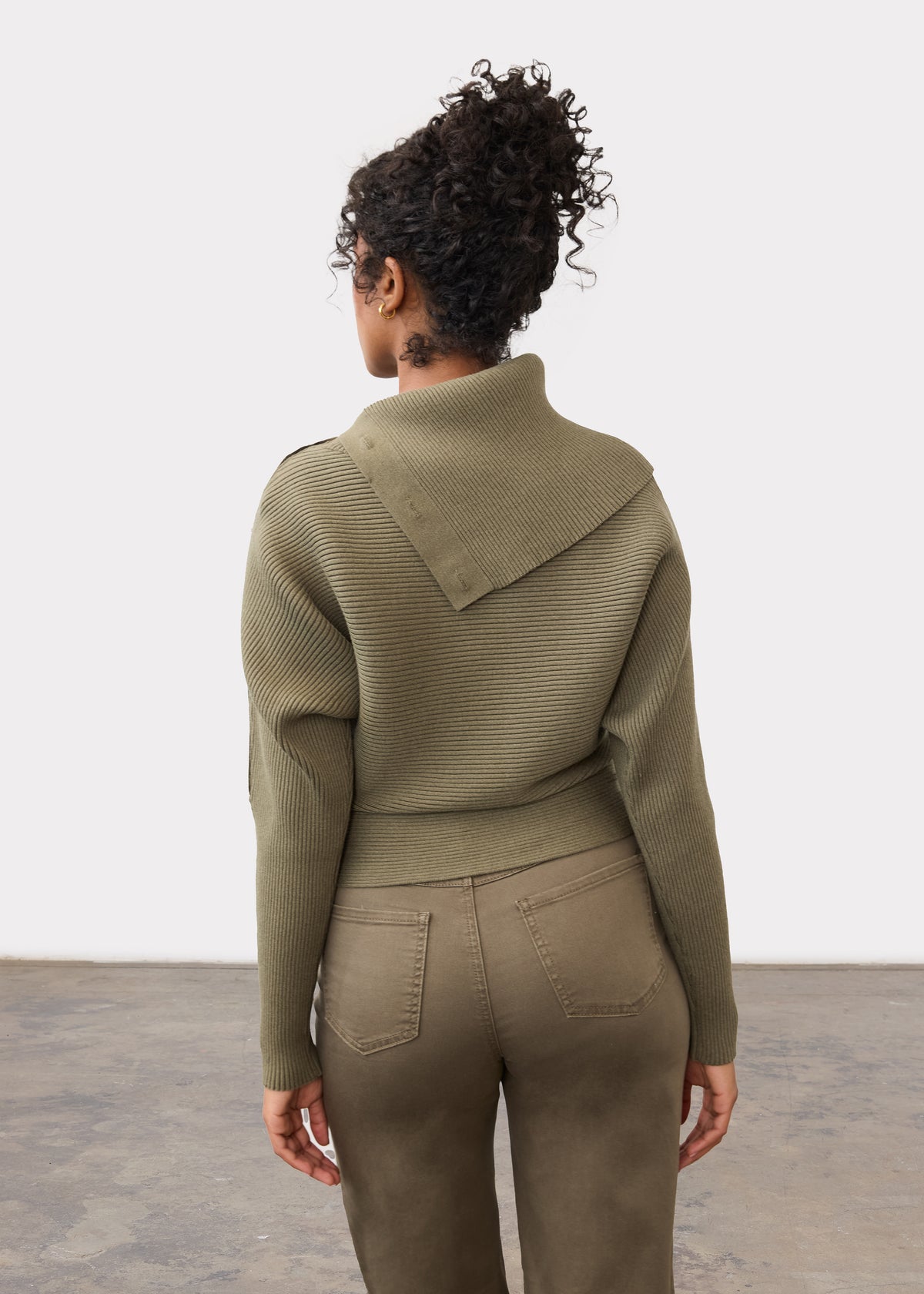 Back view of olive sweater highlighting ribbed design and button embellishments by French Dressing Jeans (FDJ)