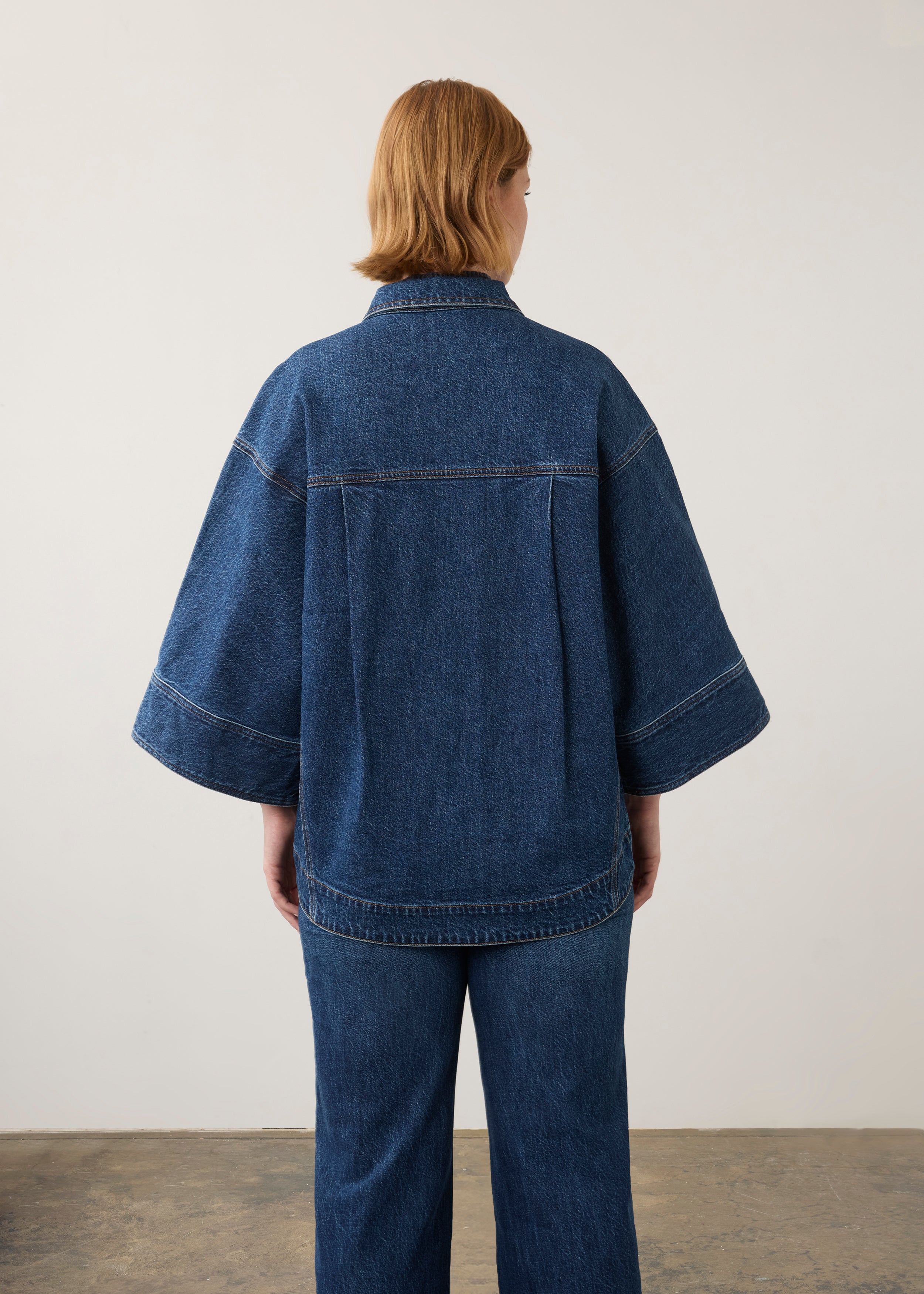 Back view of oversized medium blue utility jacket showing elegant drape by French Dressing Jeans (FDJ) par French Dressing Jeans (FDJ)
