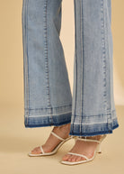 Close-up of light metallic lime trousers showing hem and seam detail by French Dressing Jeans (FDJ)