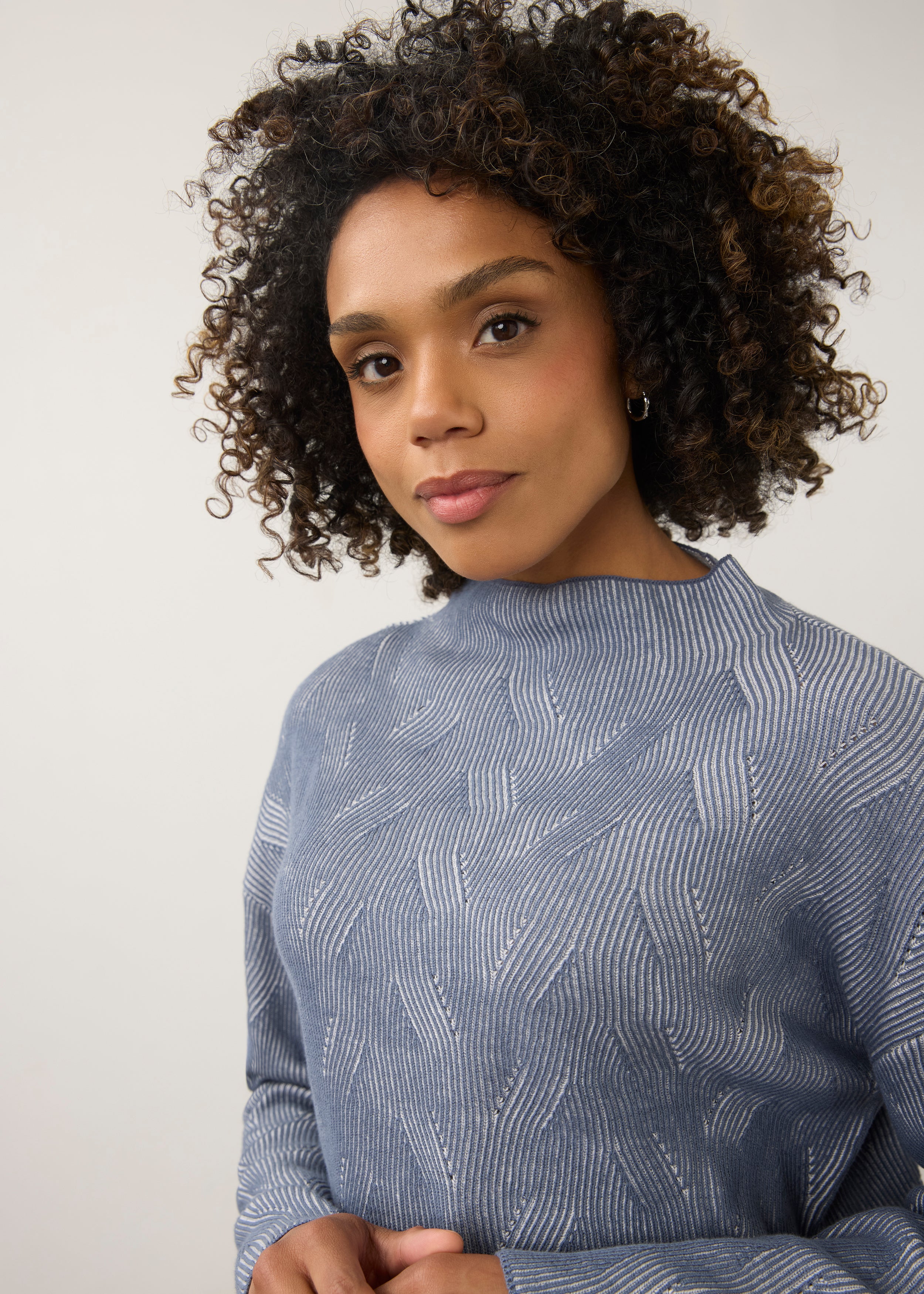 Close-up of blue textured top with high collar detail by French Dressing Jeans (FDJ)