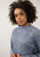 Close-up of blue textured top with high collar detail by French Dressing Jeans (FDJ)