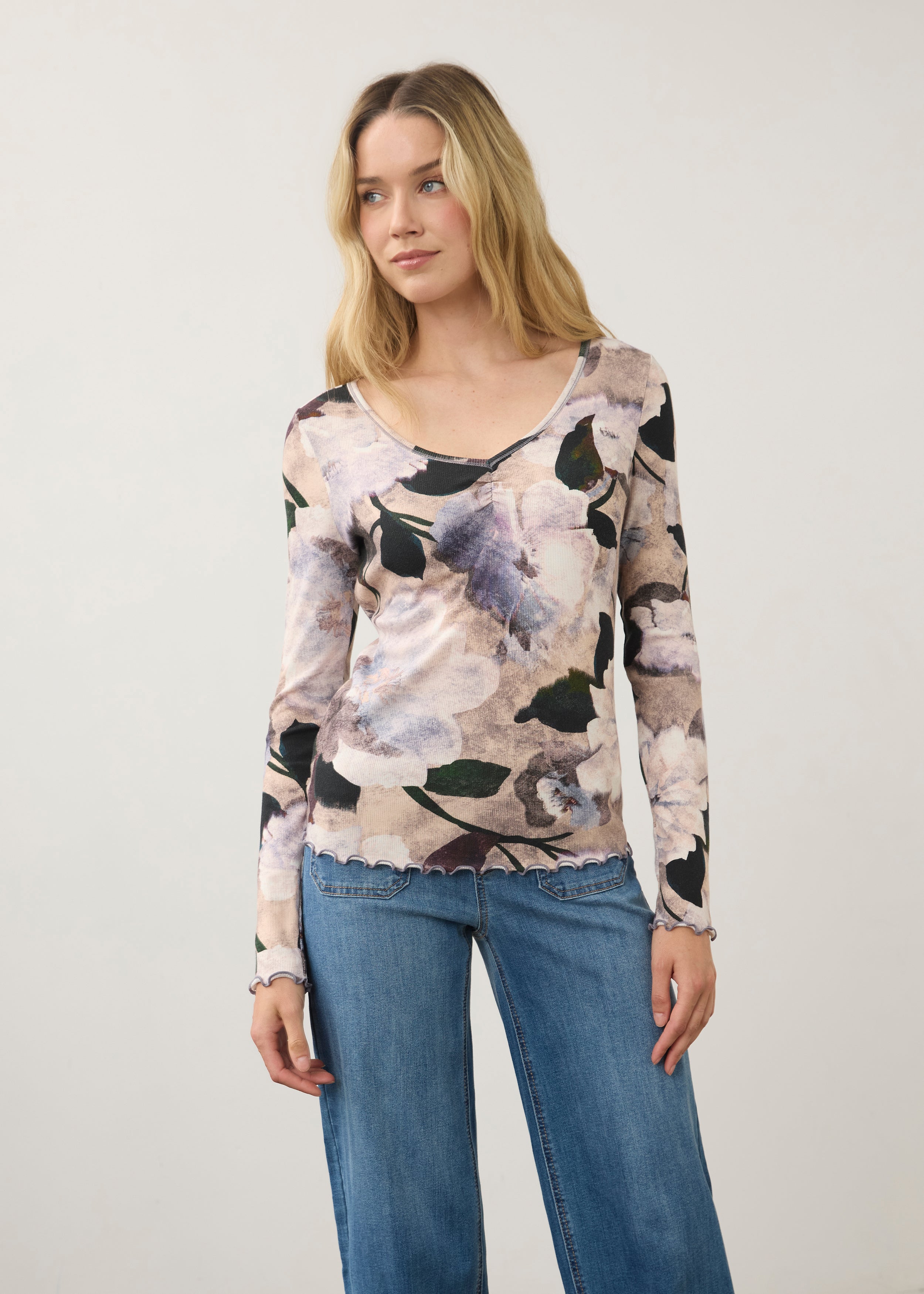 Front view of floral long sleeve V-neck top in Winter Taupe, paired with denim jeans by French Dressing Jeans (FDJ)