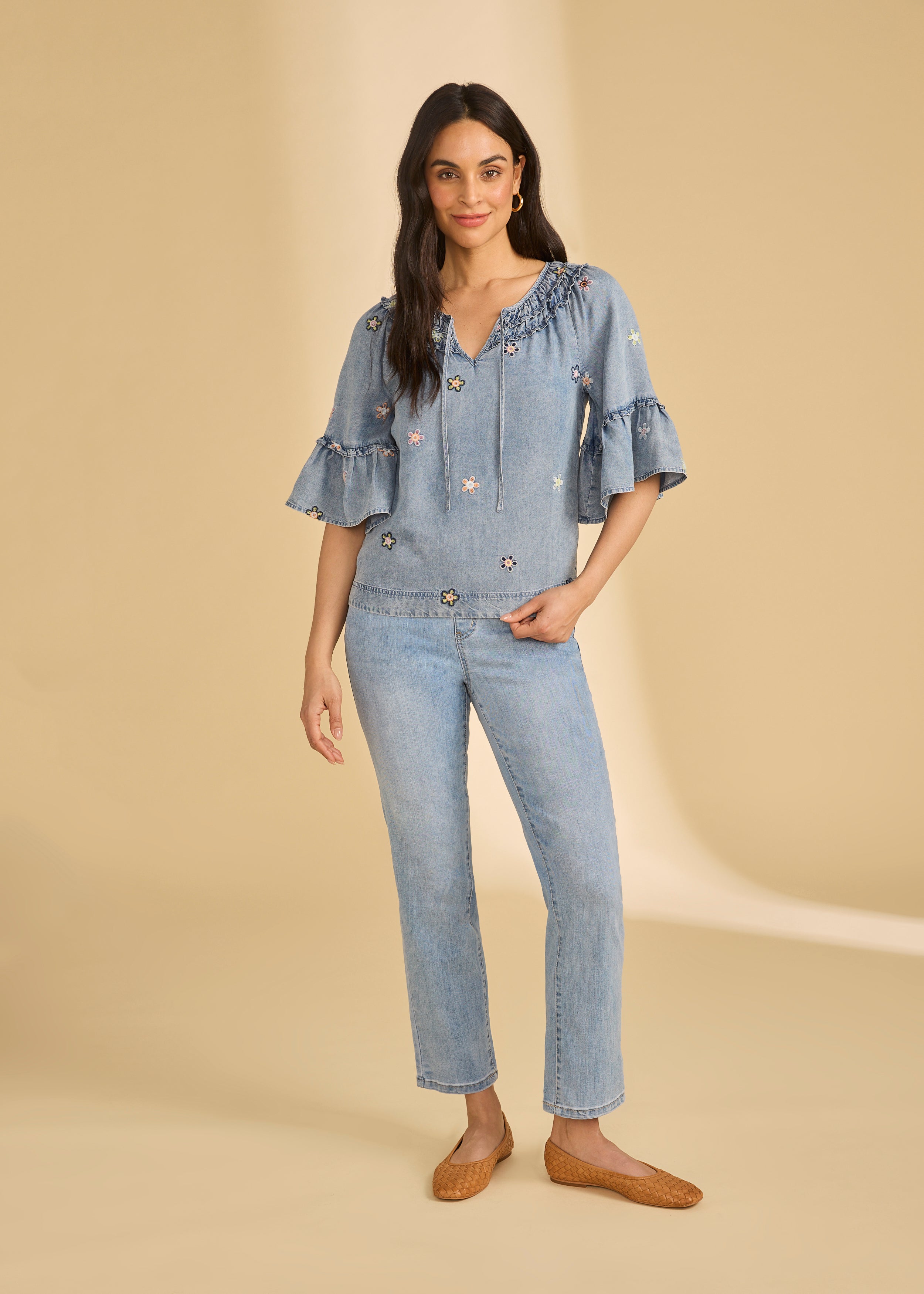 Full view of denim top with floral embroidery and straight-leg jeans by French Dressing Jeans (FDJ)
