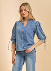 Front view of chambray shirt with lace-up sleeves and stand collar by French Dressing Jeans (FDJ)