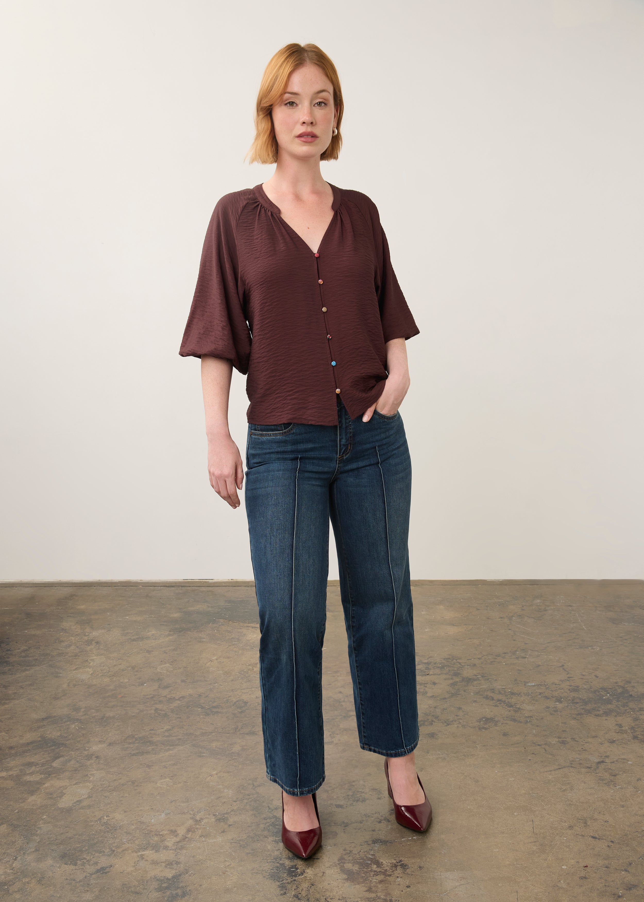 Model in maroon blouse and jeans, full body view by French Dressing Jeans (FDJ)