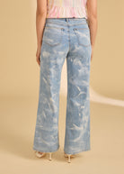 Back view of light denim jeans showing patch pockets and faded wash by French Dressing Jeans (FDJ)