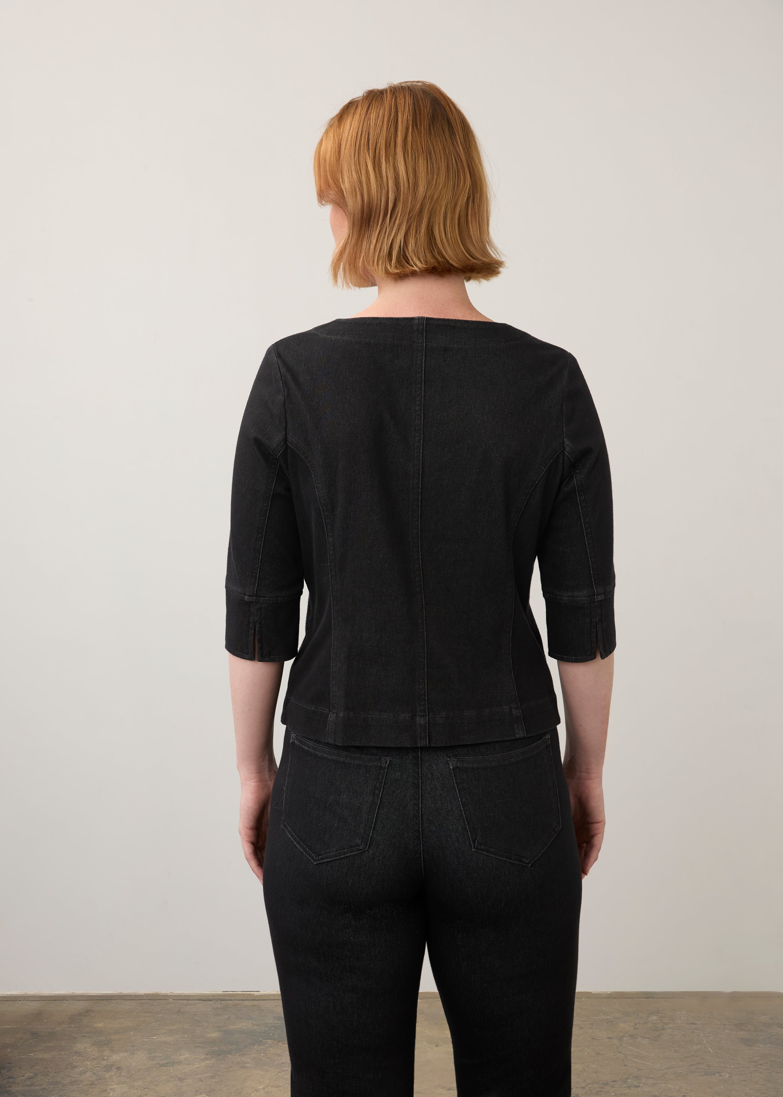 Back view of black button-up top with elbow-length sleeves and seam detailing by French Dressing Jeans (FDJ)