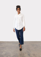 Full view of white shirt styled with denim in a casual setting by French Dressing Jeans (FDJ)
