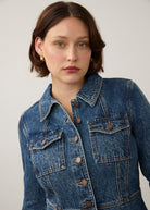 Close-up of medium blue utility jacket highlighting flap pockets and button details by French Dressing Jeans (FDJ) par French Dressing Jeans (FDJ)
