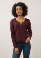 Front view of burgundy sweater with colorful button detail by French Dressing Jeans (FDJ)