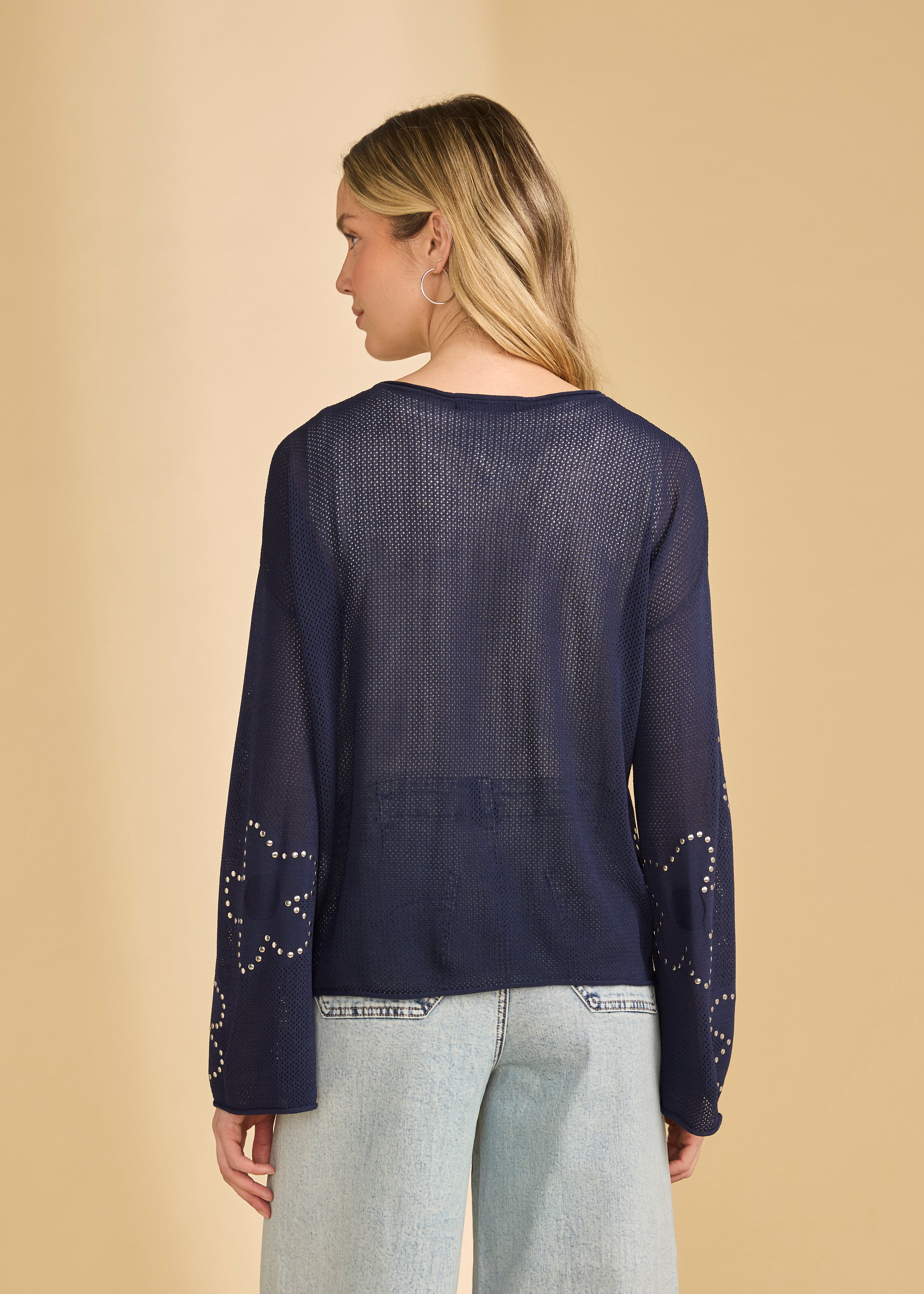 Back view of navy sweater showcasing sheer knit and relaxed fit by French Dressing Jeans (FDJ)