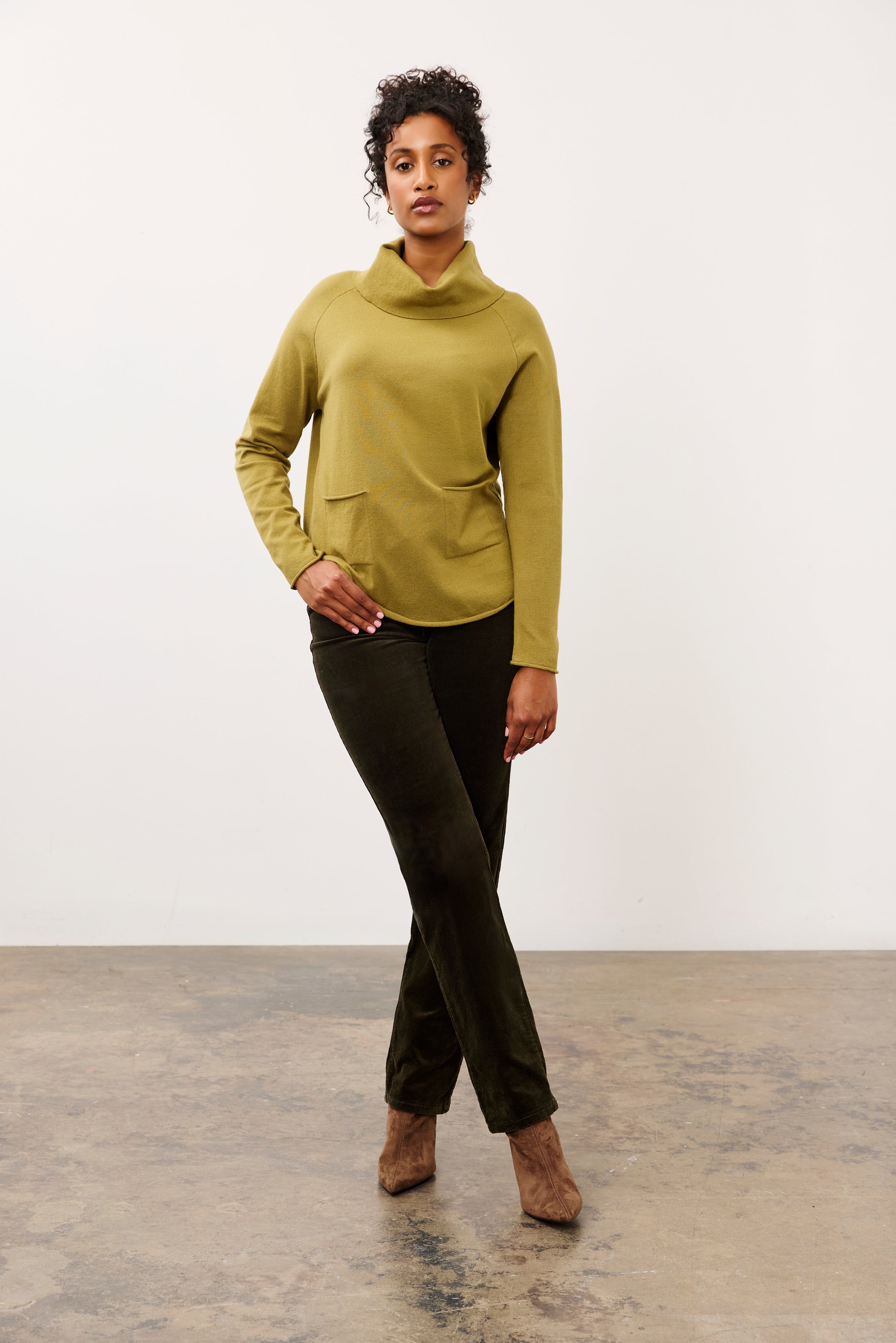 Full outfit view of olive sweater styled with dark pants by French Dressing Jeans (FDJ)