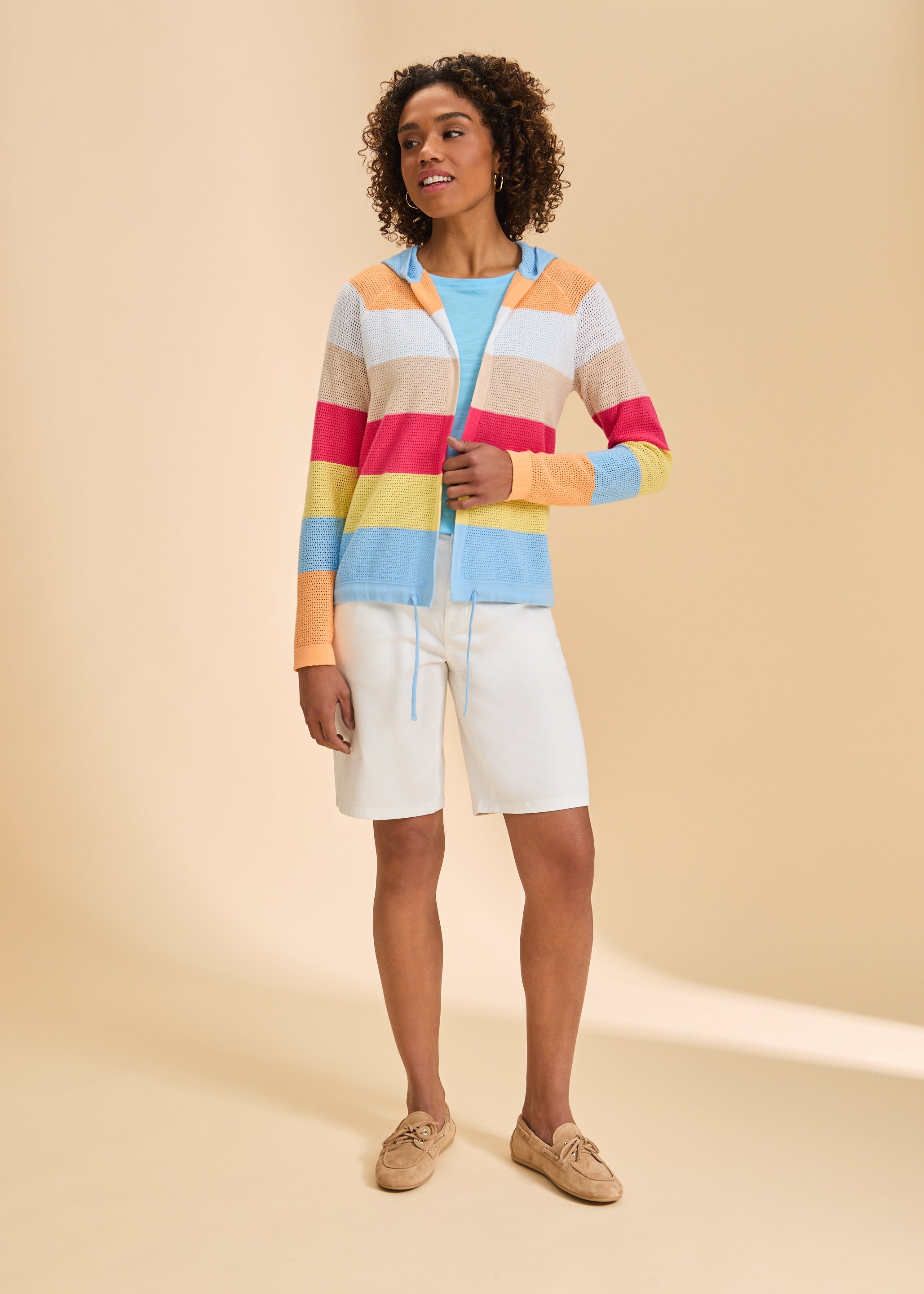 Full view of striped cardigan paired with white shorts, highlighting versatile style by French Dressing Jeans (FDJ)