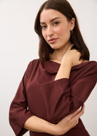 Close-up of burgundy top showcasing fabric texture and sleeve details by French Dressing Jeans (FDJ)