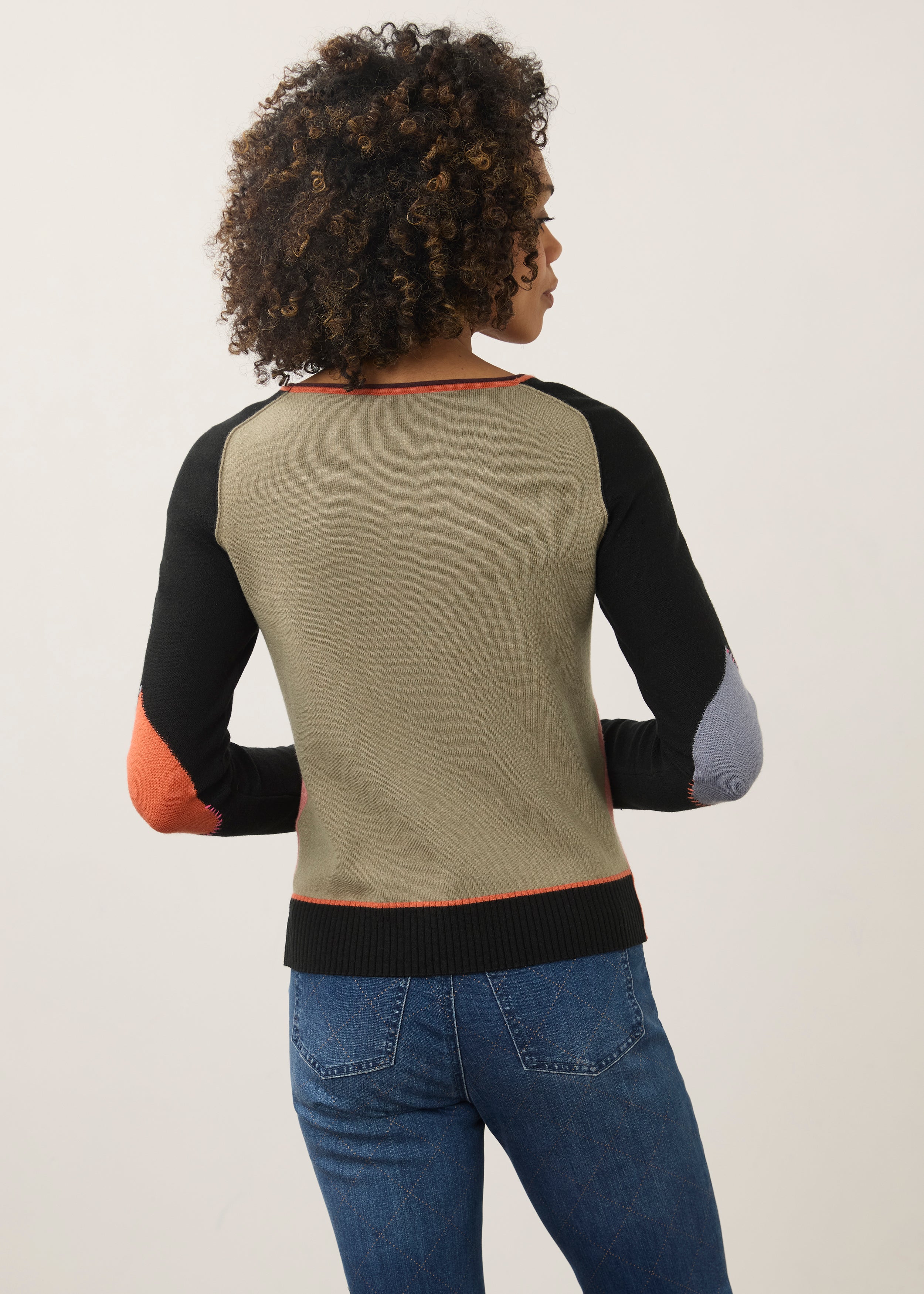 Back view of pink and black colorblock sweater showing seamless design by French Dressing Jeans (FDJ)
