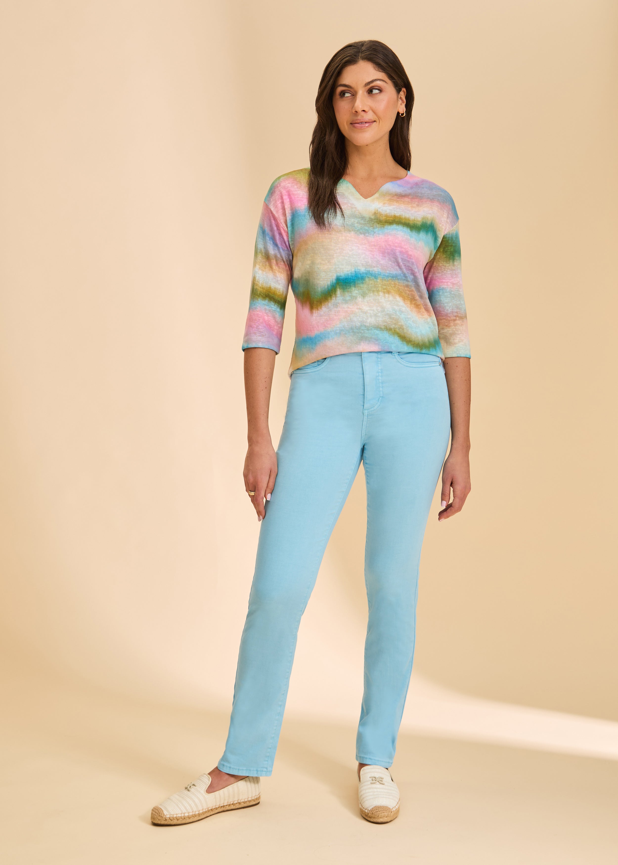 Front view of light blue straight-leg jeans, paired with colorful top by French Dressing Jeans (FDJ)