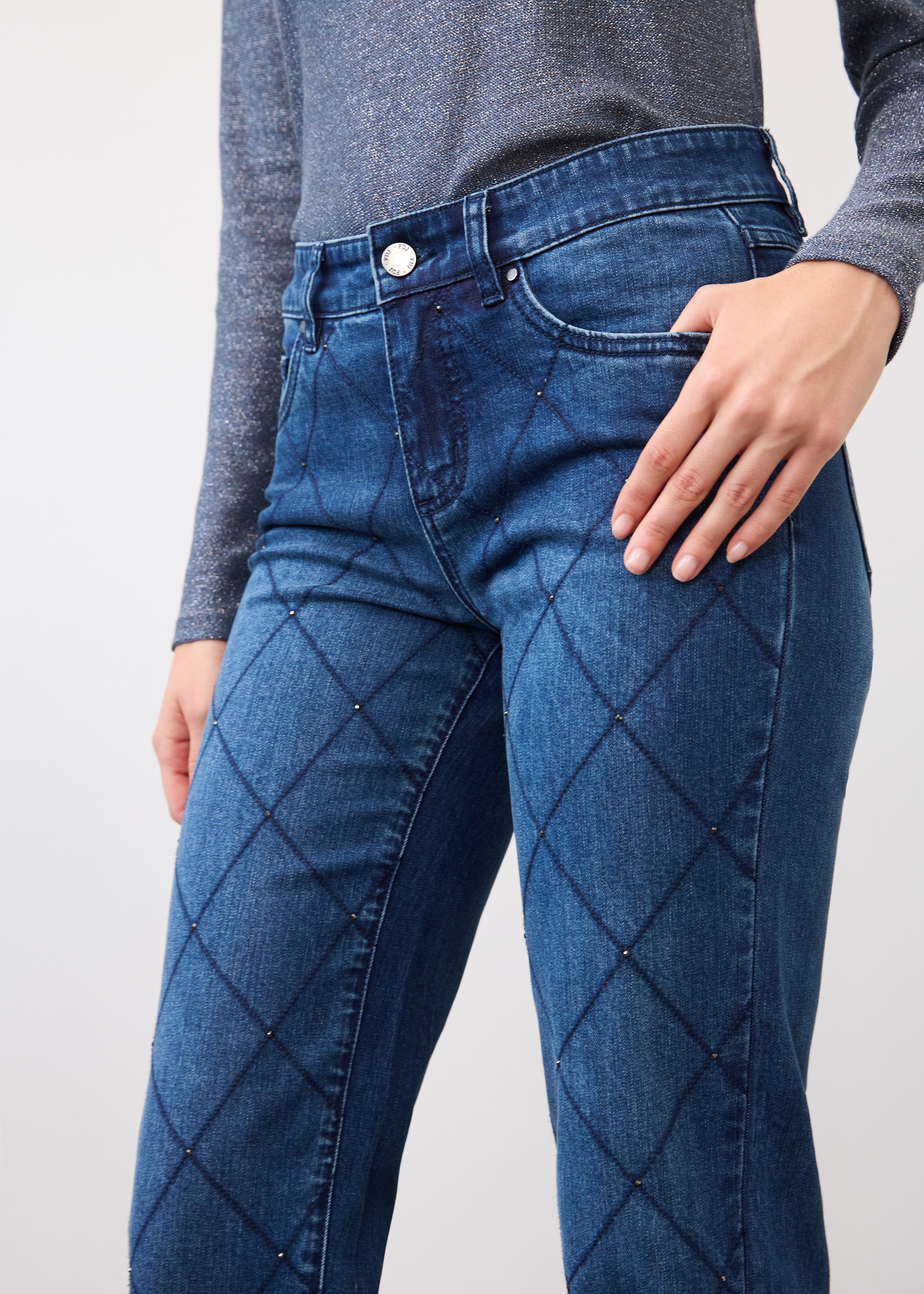 Close-up of indigo jeans detailing grid pattern and mid-rise waist by French Dressing Jeans (FDJ)