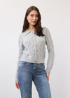 Front view of gray cabled cardigan with button closure and neat collar by French Dressing Jeans (FDJ)