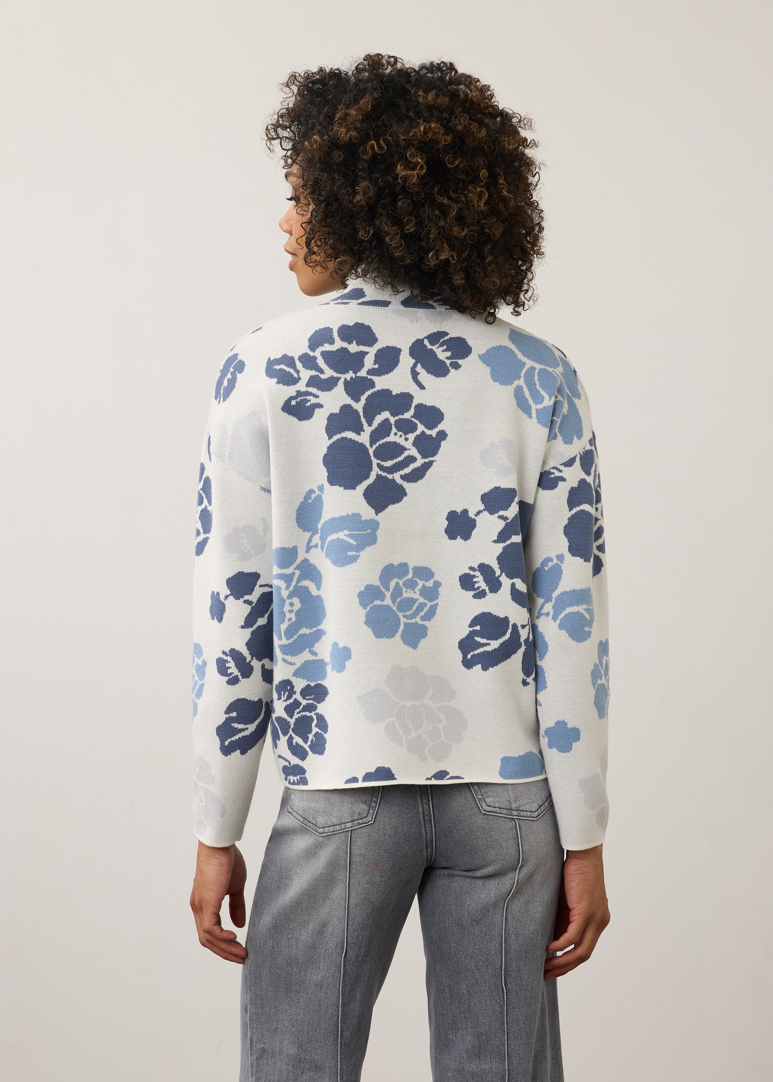 Back view of blue floral sweater showing seamless design by French Dressing Jeans (FDJ)