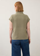 Back view of olive green ribbed top with high collar and seamless finish by French Dressing Jeans (FDJ)