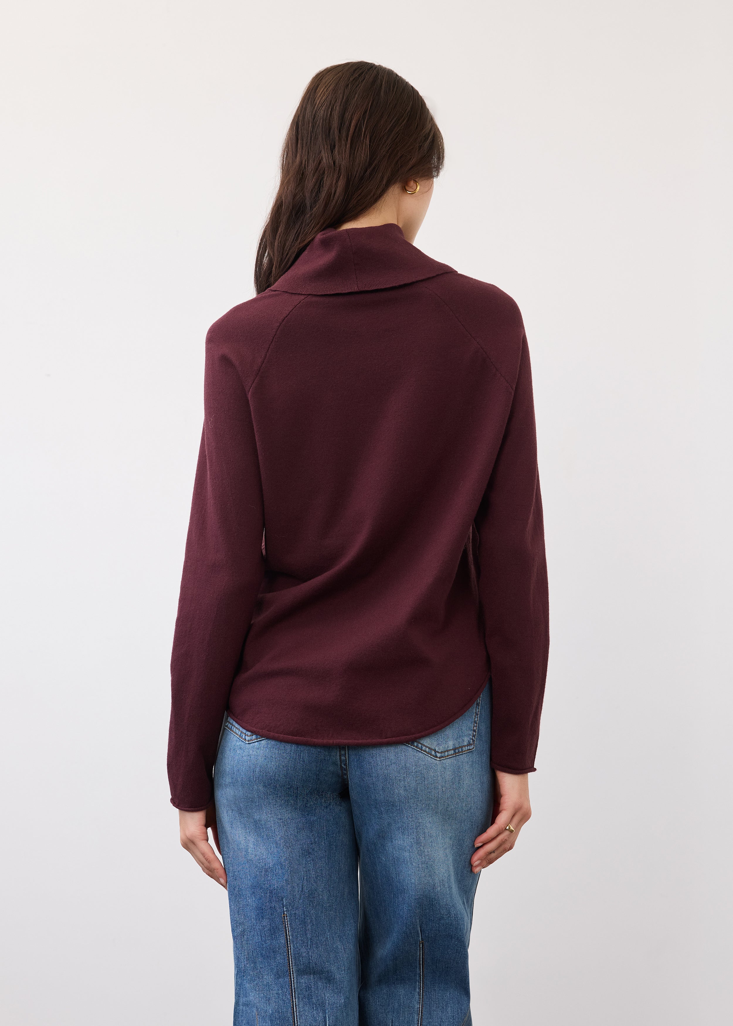 Back view of burgundy sweater with relaxed fit and seamless shoulders by French Dressing Jeans (FDJ)