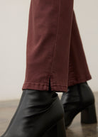 Detail shot of burgundy straight ankle denim leg slit by French Dressing Jeans (FDJ) par French Dressing Jeans (FDJ)