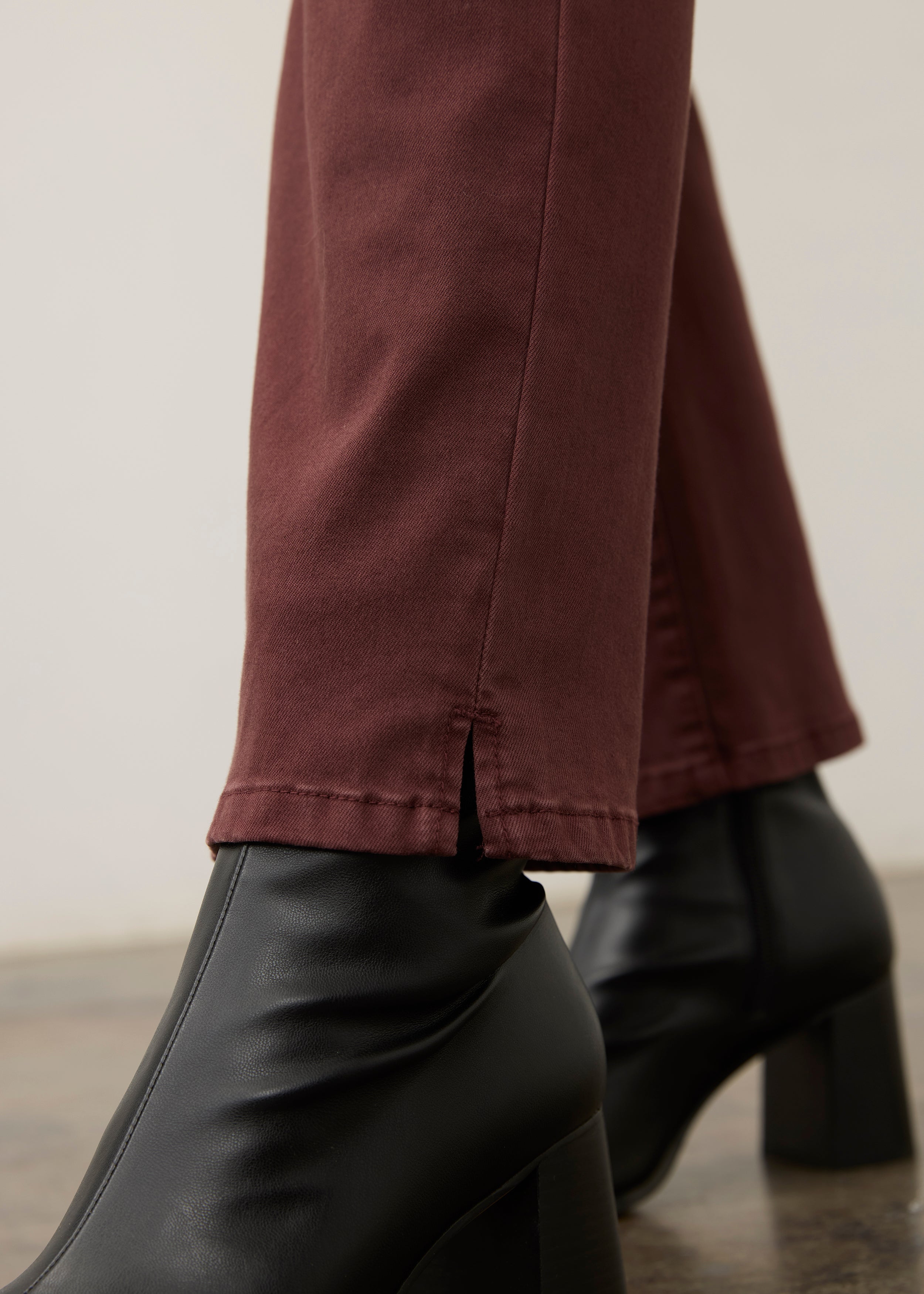 Detail shot of burgundy straight ankle denim leg slit by French Dressing Jeans (FDJ) par French Dressing Jeans (FDJ)