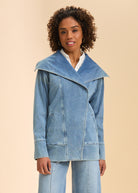 Front view of light blue denim jacket with wide collar and welt pockets by French Dressing Jeans (FDJ)