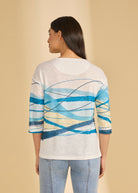 Back view of white top featuring blue wave design and casual fit by French Dressing Jeans (FDJ)