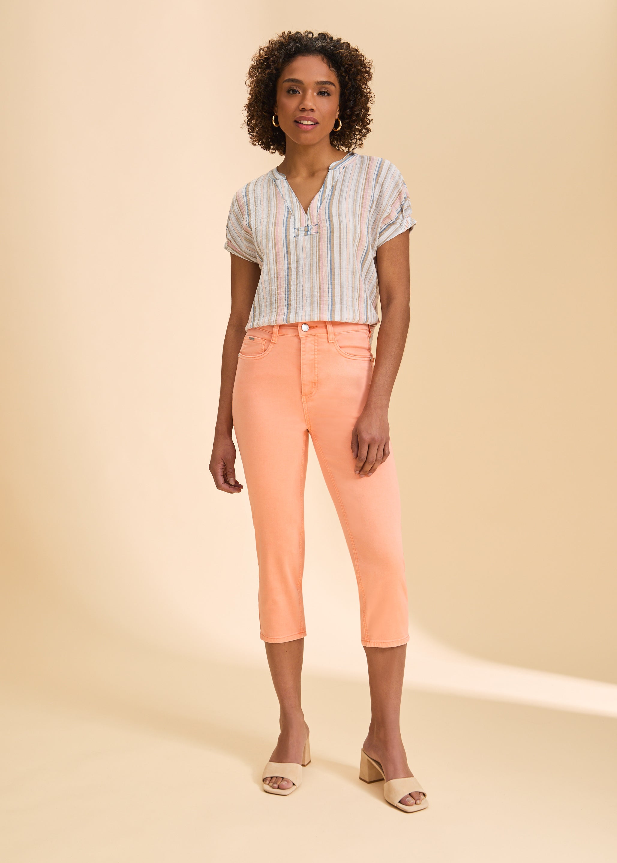 Full view of multicolor striped blouse paired with peach pants and sandals by French Dressing Jeans (FDJ)