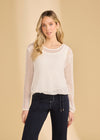 Front view of white mesh long sleeve top with scoop neck paired with navy pants by French Dressing Jeans (FDJ)